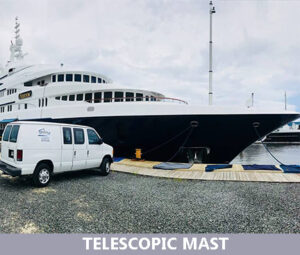 a white car parked near a ship