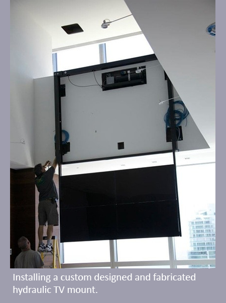 a person installing a hydraulic TV mount