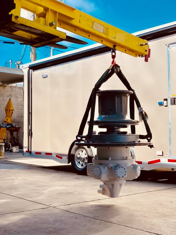 a windlass being lifted by a crane