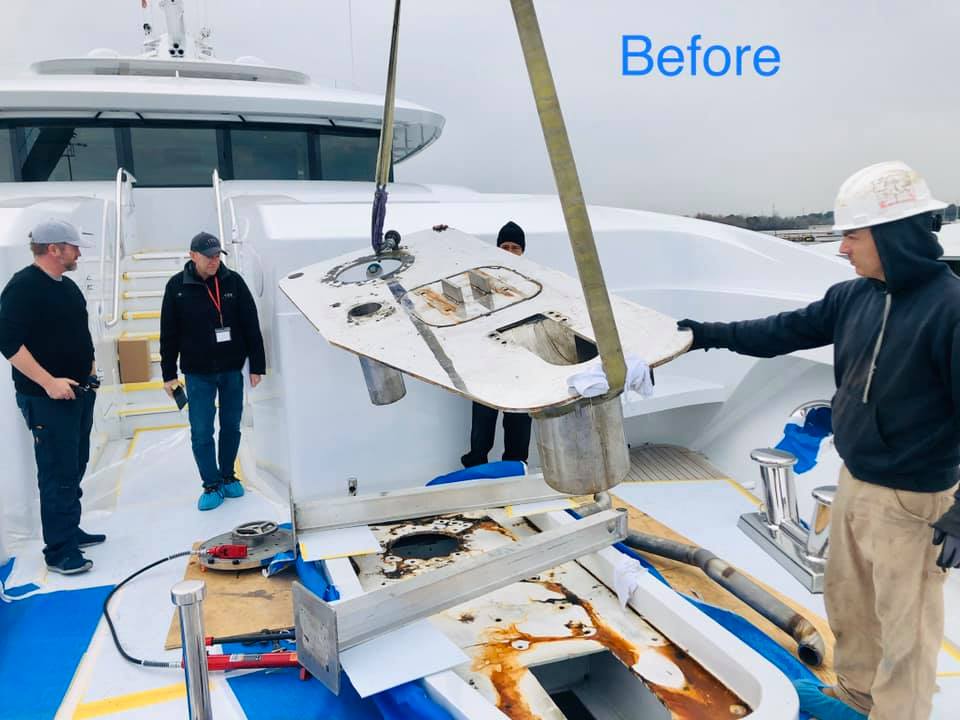 a group of people working on rebuilding a windlass